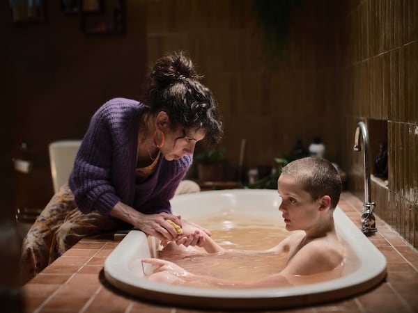 This image released by A24 shows Sally Hawkins, left, and Jonah Wren Phillips in a scene from "Bring Her Back." (Ingvar Kenne/A24 via AP)