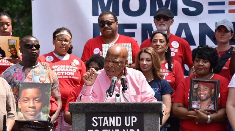 Atlanta's U.S. Rep. John Lewis rallies the crowd at a protest in Woodruff Park. The protest was organized by gun control advocates, who held it blocks away from the National Rifle Association's annual convention in downtown Atlanta.