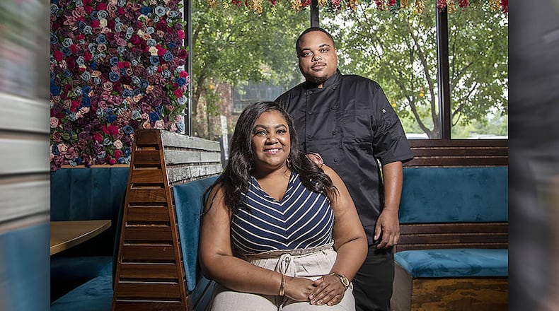 Jessica Booth, owner of Chef’d Up, and executive chef Robert Butts (right) pose for a photo at the restaurant in Atlanta’s Old Fourth Ward community, Friday, May 29, 2020.