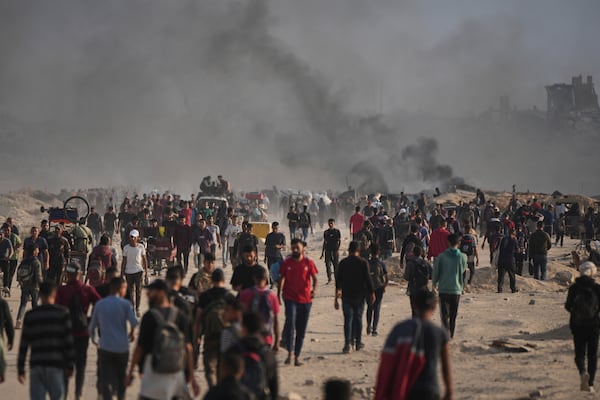 Displaced Palestinians move along the shore of Gaza city on Monday, June 9, 2025. (AP Photo/Jehad Alshrafi)