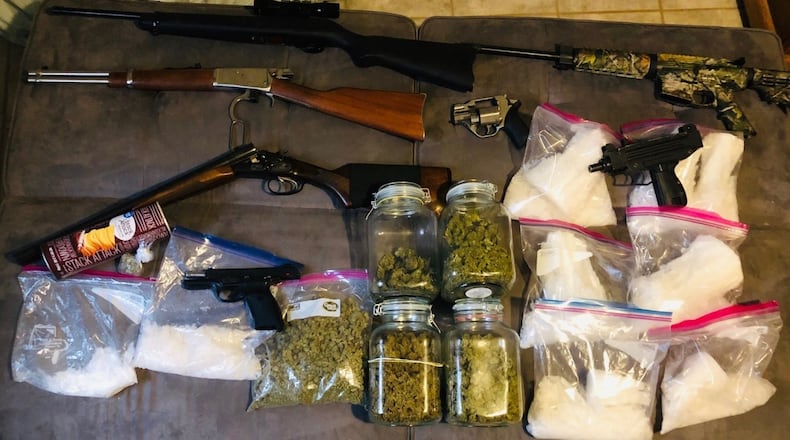 A sampling of items seized Tuesday during two Gwinnett County gang stash houses. (credit: Georgia Bureau of Investigation)