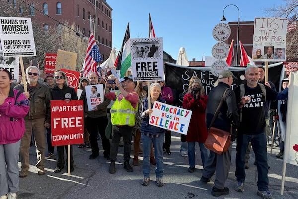 Protesters gather outside federal court ahead of a hearing for Mohsen Mahdawi, a Palestinian man arrested at a Vermont immigration office during an interview about finalizing his U.S. citizenship and a legal permanent resident who led protests against the war in Gaza at Columbia University, Wednesday, April 23, 2025 in Burlington, Vt. (AP Photo/Amanda Swinhart)