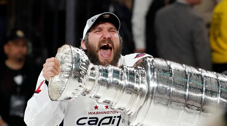 Washington Capitals left wing Alex Ovechkin hoists the Stanley Cup after the Capitals defeated the Golden Knights in Game 5 of the Stanley Cup Finals.