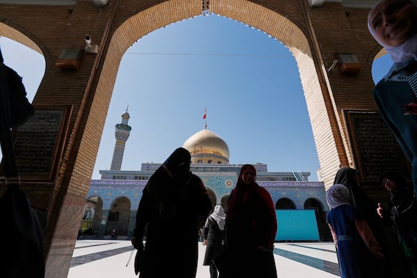 Shiite worshipers arrive at the Sayyida Zeinab Shrine, where they believe Zeinab, the granddaughter of Prophet Muhammad, is entombed, in Sayyida Zeinab, south of Damascus, Syria, Saturday, March 15, 2025. (AP Photo/Omar Sanadiki)