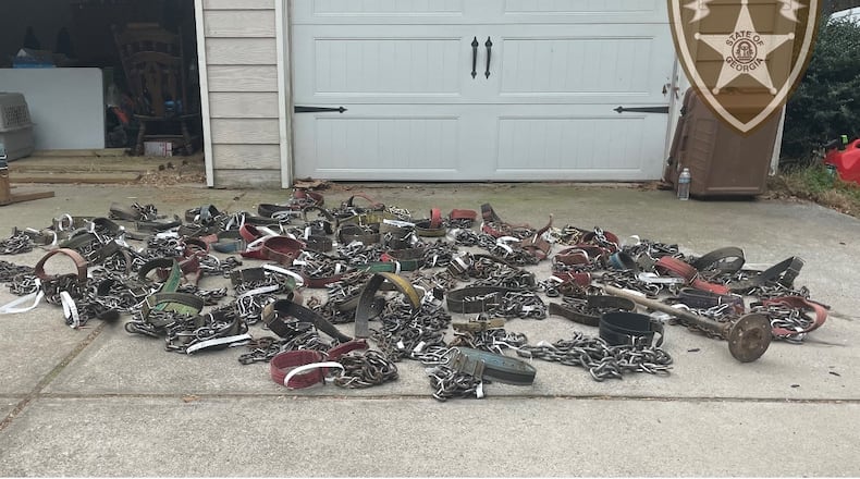 The dogs were found tied to various objects outside Vincent Lemark Burrell's home or held in the basement, authorities said.