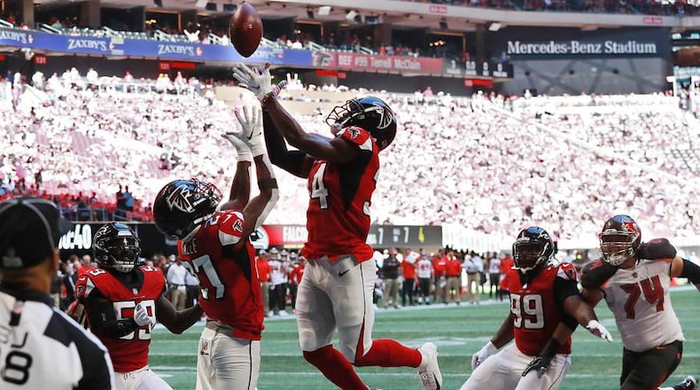 Falcons cornerback Brian Poole goes up to intercept  Buccaneers quarterback Jameis Winston in the end zone Sunday, Oct 14, 2018, in Atlanta. Curtis Compton/ccompton@ajc.com