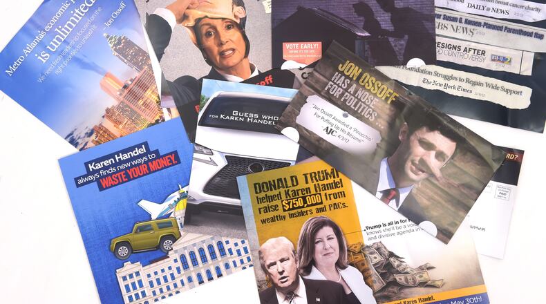 Campaign mailers for 6th District candidates Jon Ossoff and Karen Handel. KENT D. JOHNSON / AJC