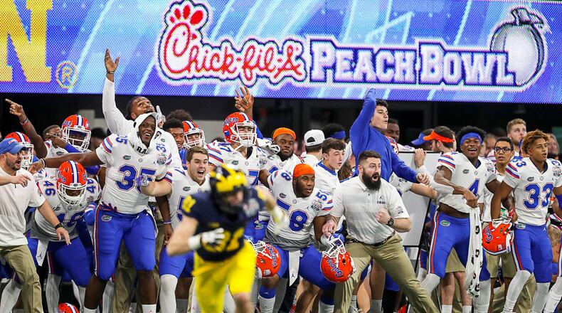 The Florida Gators bench cheers during the second half of the Chick-fil-A Peach Bowl at Mercedes-Benz Stadium in Atlanta, Saturday, December 29, 2018. The Florida Gators beat the Michigan Wolverines, 41-15. (ALYSSA POINTER/ALYSSA.POINTER@AJC.COM)