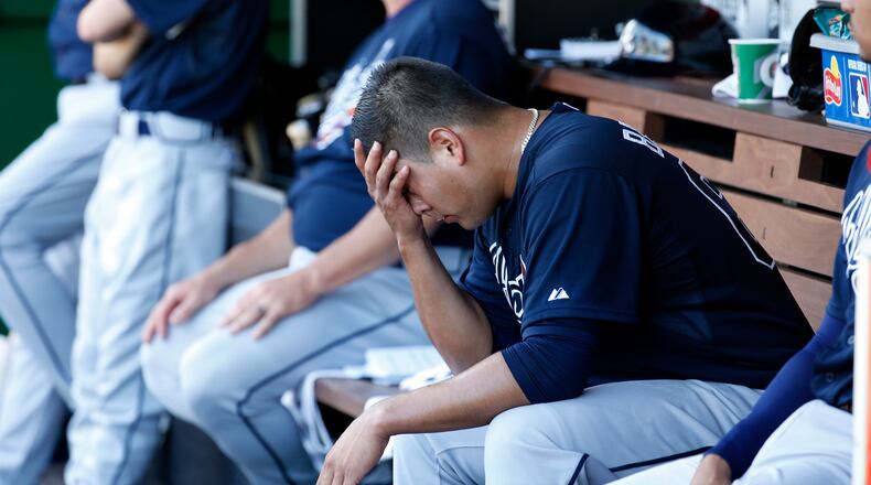 Atlanta Braves starting pitcher Manny Banuelos wipes his face after he was relieved during the third inning of a baseball game against the Washington Nationals at Nationals Park, Sunday, Sept. 6, 2015, in Washington. (AP Photo/Alex Brandon)