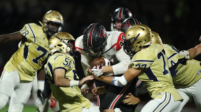 October 12, 2018 - Atlanta: North Oconee running back Adam Weyland (40) fights for yards against St. Pius defenders in the second half Friday, October 12, 2018, in Atlanta. St. Pius won 31-21. (JASON GETZ/SPECIAL TO THE AJC)