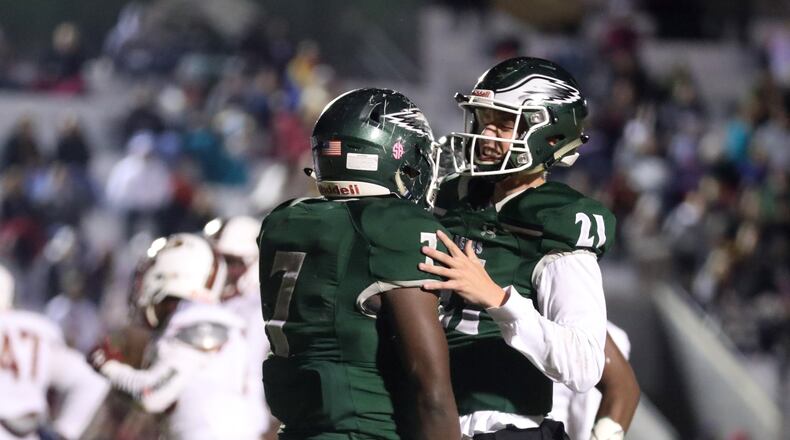 Collins Hill quarterback Sam Horn (21) is second in Class 7A and fourth overall in passing yards with 1,007 through four games. (Jason Getz/Special)