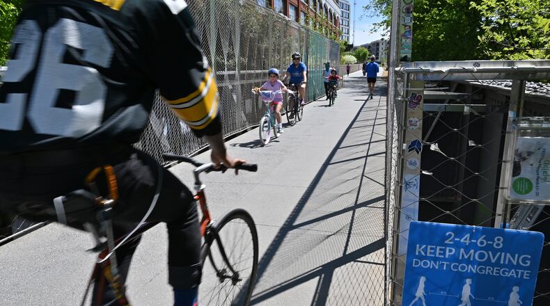People still enjoy on the Atlanta Beltline trail on Thursday, April 2, 2020. Fulton County’s stay-at-home order issued on Wednesday to help stem the spread of the coronavirus failed to include two key provisions that some of the county’s highest-ranking health officials had advocated for in private: shutting down the Beltline and Atlanta parks, according to emails obtained by The Atlanta Journal-Constitution. (Hyosub Shin / Hyosub.Shin@ajc.com)