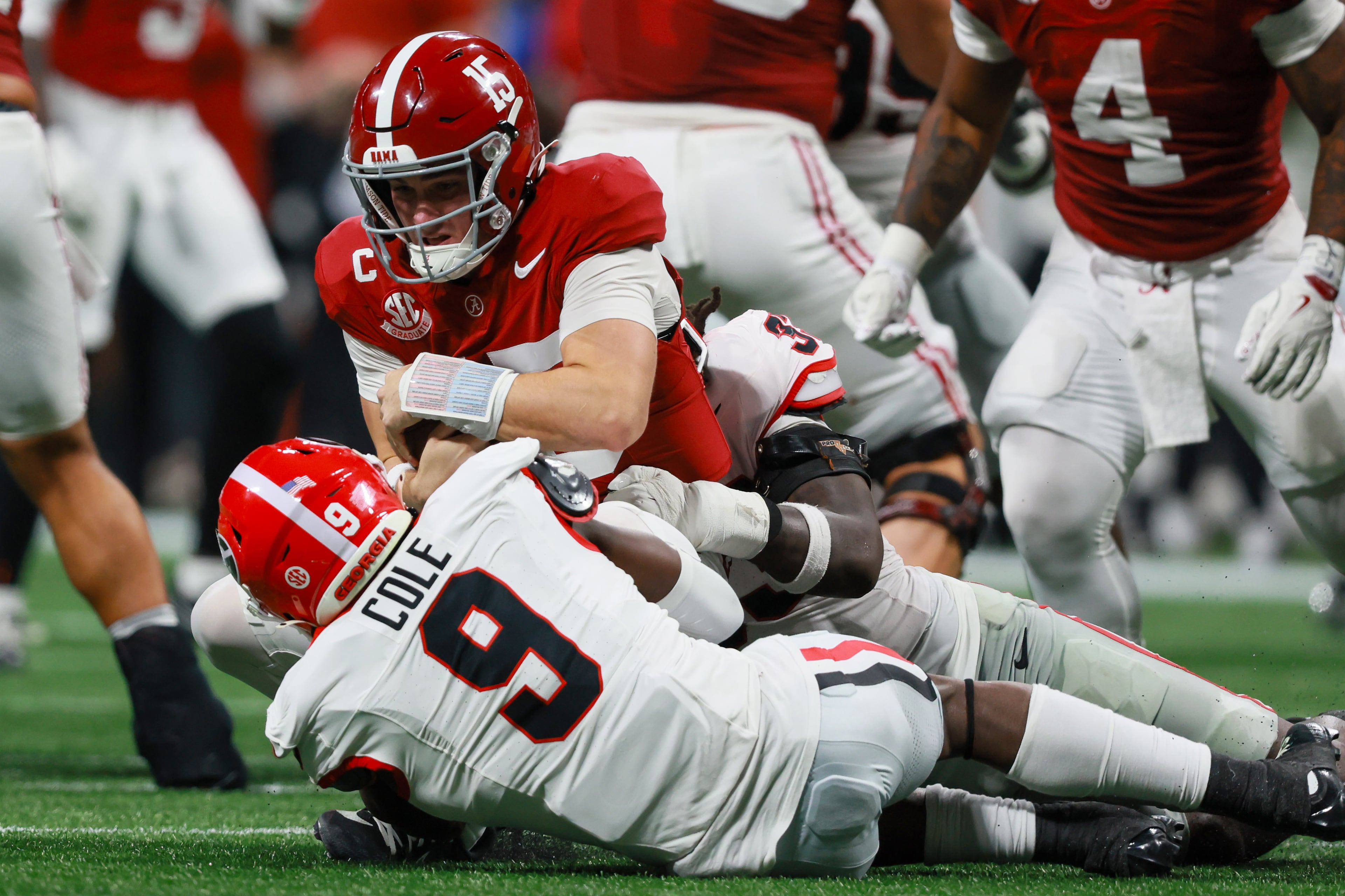 Alabama quarterback Ty Simpson (15) is sacked by Georgia linebacker Chris Cole (9) during the fourth quarter of the SEC Championship game at Mercedes-Benz Stadium, Saturday, Dec. 6, 2025, in Atlanta. (Jason Getz / AJC)