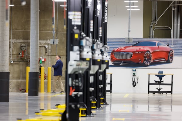 A person tours the mechanical shop of Mercedes-Benz’s new facility on Wednesday, July 8, 2026, in Atlanta. The center will absorb teams relocating from other facilities across the U.S. (Arvin Temkar/AJC)
