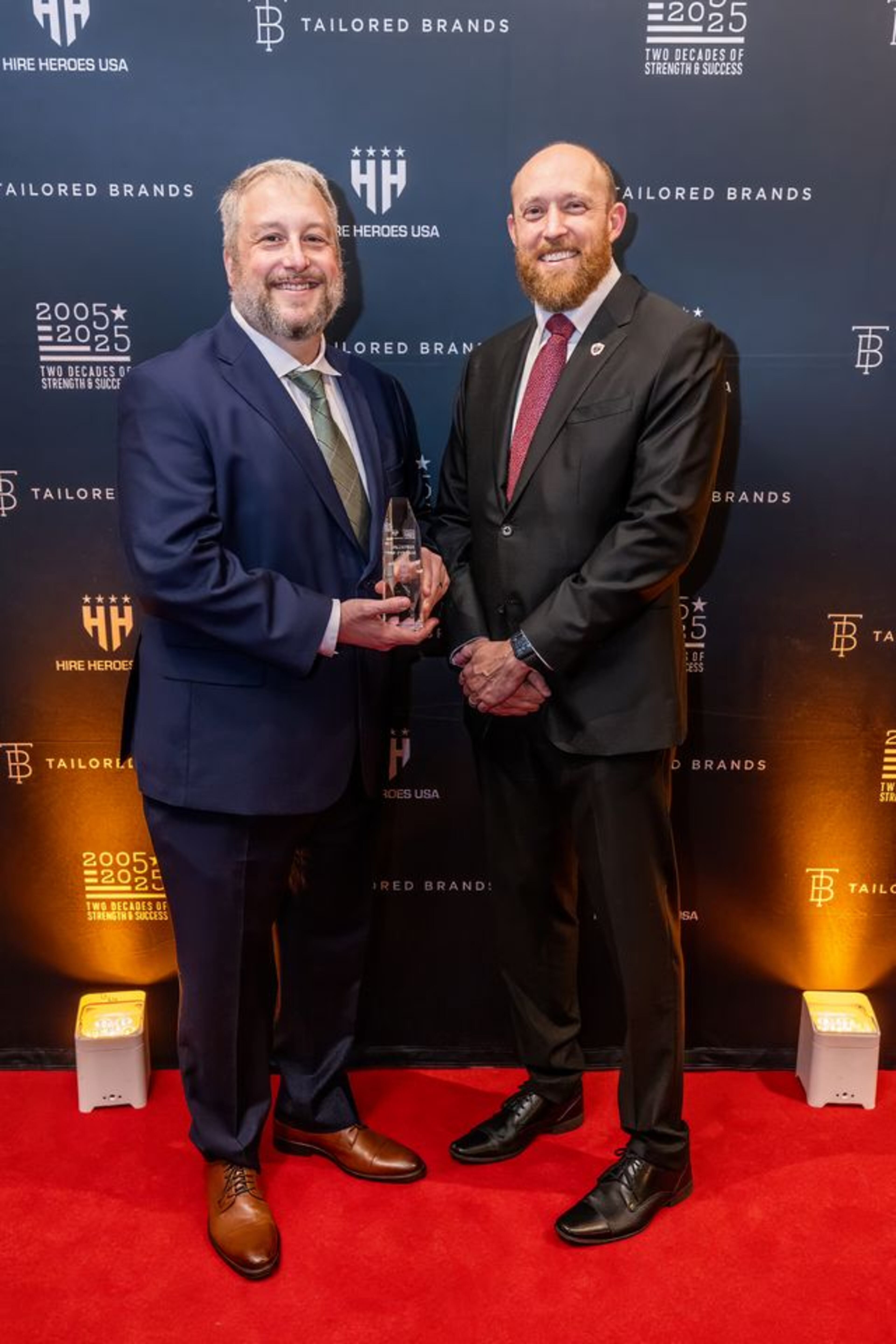 Jules Borghardt (left) was recognized as volunteer of the year at Hire Heroes USA’s  Empowerment Gala in March. He received the award from CEO Ross Dickman. (Courtesy of Hire Heroes USA)