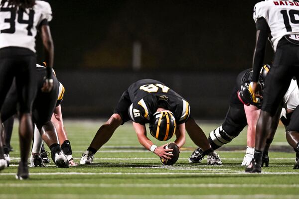 Sequoyah’s Max Martineau (center) prepares to snap the ball during the second half against Lee County on Friday, Sept. 4, 2026, in Canton. (Daniel Varnado for the AJC)