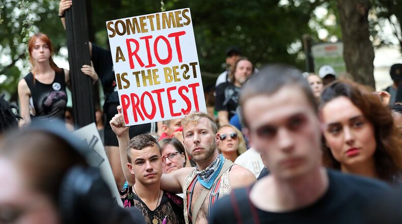 Hundreds of protesters marched from Woodruff Park to Piedmont Park on Aug. 13, 2017, in a rally organized by All Out Atlanta in response to violence in Virginia. CURTIS COMPTON / CCOMPTON@AJC.COM