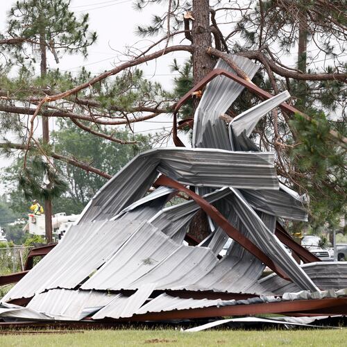 A meal building rests twisted in a tree after a possible tornado, Sunday, April 26, 2026, in Springtown, Texas (Elías Valverde II/The Dallas Morning News via AP)