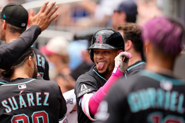 Arizona Diamondbacks second baseman Ketel Marte (4) celebrates his solo homer against the Atlanta Braves in the eighth inning of a baseball game, Thursday, June 5, 2025, in Atlanta. (AP Photo/Mike Stewart)