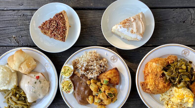 This takeout order from Magnolia Room includes turkey and dressing with mashed potatoes, green beans and a yeast roll; country-fried steak with rice, deviled eggs, fried okra and cracklin cornbread; fried chicken with collards, macaroni and cheese, and jalapeño cornbread; and pecan pie and coconut meringue pie. Wendell Brock for The Atlanta Journal-Constitution
