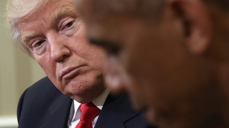 President Barack Obama speaks while meeting with President-elect Donald Trump (L) following a meeting in the Oval Office November 10, 2016 in Washington, DC.
