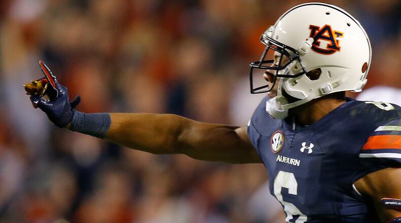 Auburn's Carlton Davis celebrates after making a tackle during the fourth quarter against the Alabama Crimson Tide  Nov. 25, 2017, at Jordan Hare Stadium on in Auburn.