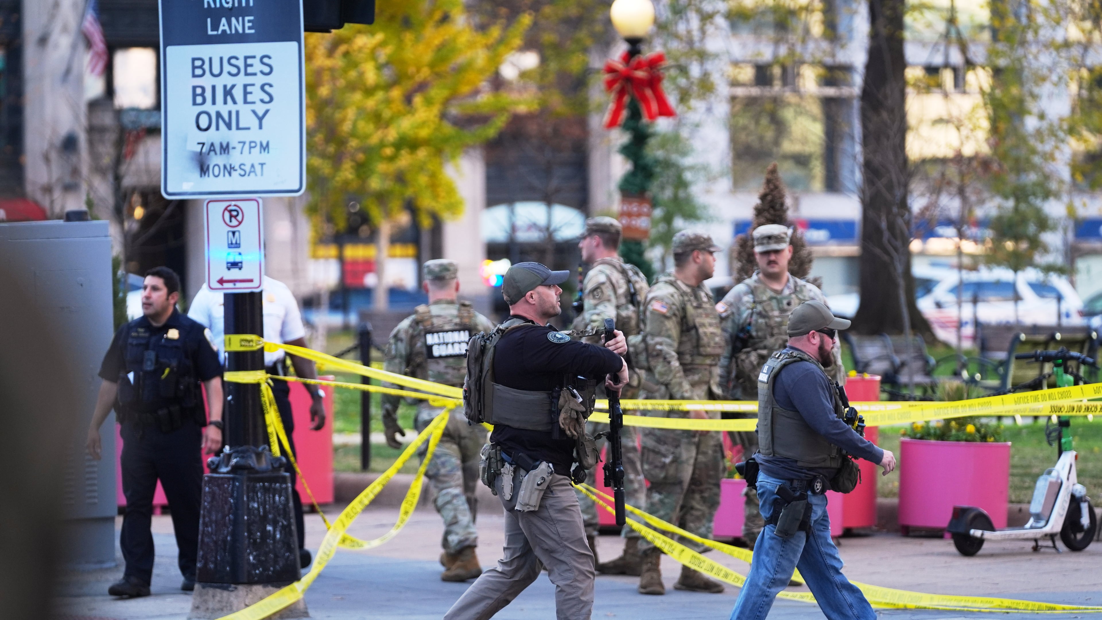 U.S. Marshalls and National Guard troops are seen after reports of two National Guard soldiers shot near the White House in Washington, Wednesday, Nov. 26, 2025. (AP Photo/Evan Vucci)