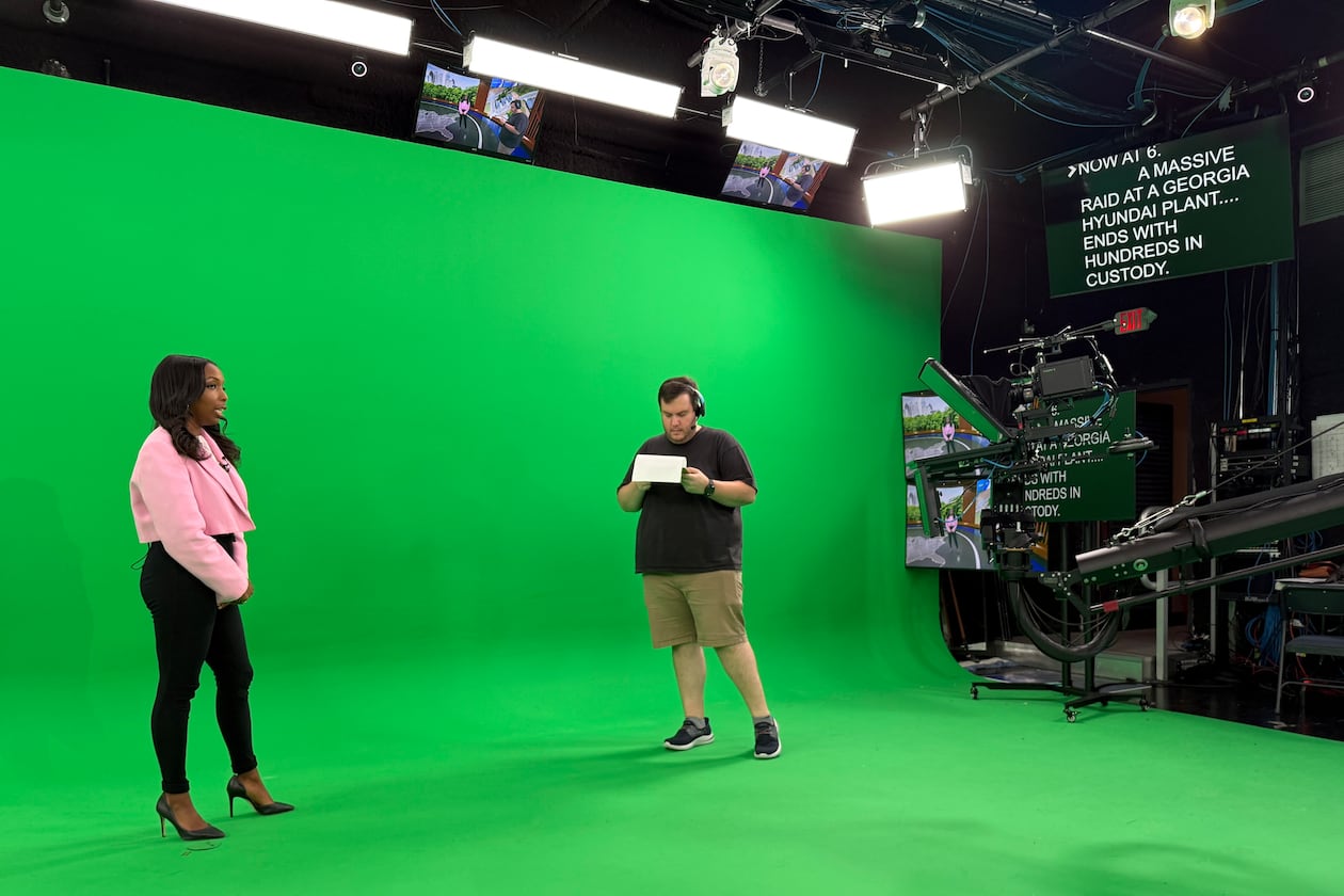 CBS Atlanta news anchor Jobina Fortson-Evans (left) and director Sam Snook attend a newscast rehearsal on Friday, Sept. 5, 2025, in Atlanta. (Courtesy of Alex Sanz/CBS News Atlanta)