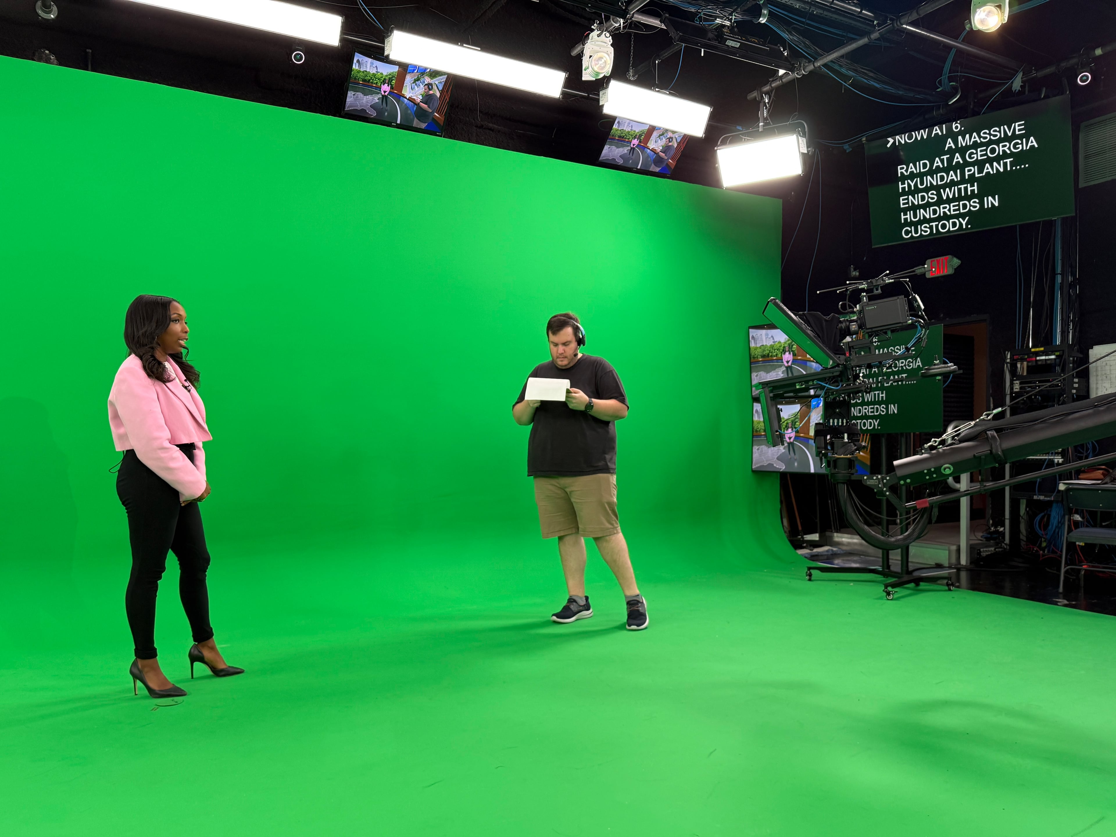 CBS News Atlanta anchor Jobina Fortson-Evans and director Sam Snook rehearse before a newscast on Friday, Sept. 5, 2025. CBS News Atlanta is the first fully augmented and virtual reality newsroom in the market. (Alex Sanz/CBS News Atlanta)