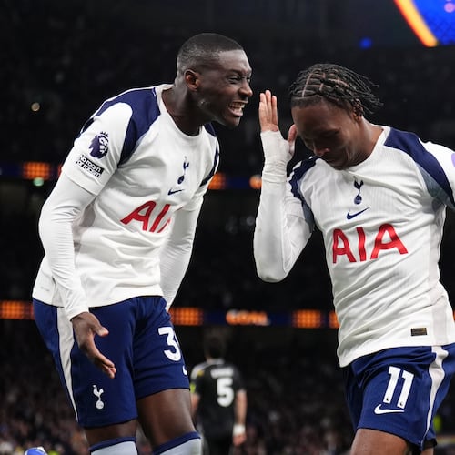 Tottenham Hotspur's Mathys Tel, right, celebrates scoring during the English Premier League soccer match between Tottenham Hotspur and Leeds United in London, Monday May 11, 2026. (John Walton/PA via AP)