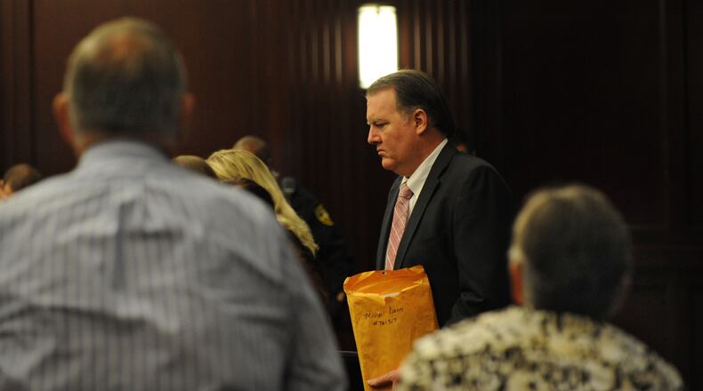 Michael Dunn enters the courtroom as his parents, Phillip and Sandra Dunn look on, as the day's proceedings begin. The retrial of Michael Dunn on murder charges for the shooting death of 17-year old Jordan Davis in a dispute over loud music at at Jacksonville gas station in November of 2012 continued Wednesday with jury instructions and deliberation. Judge Russell Healey presided over the trial held in his courtroom in the Duval County Courthouse in Jacksonville, FL on Oct. 1, 2014.