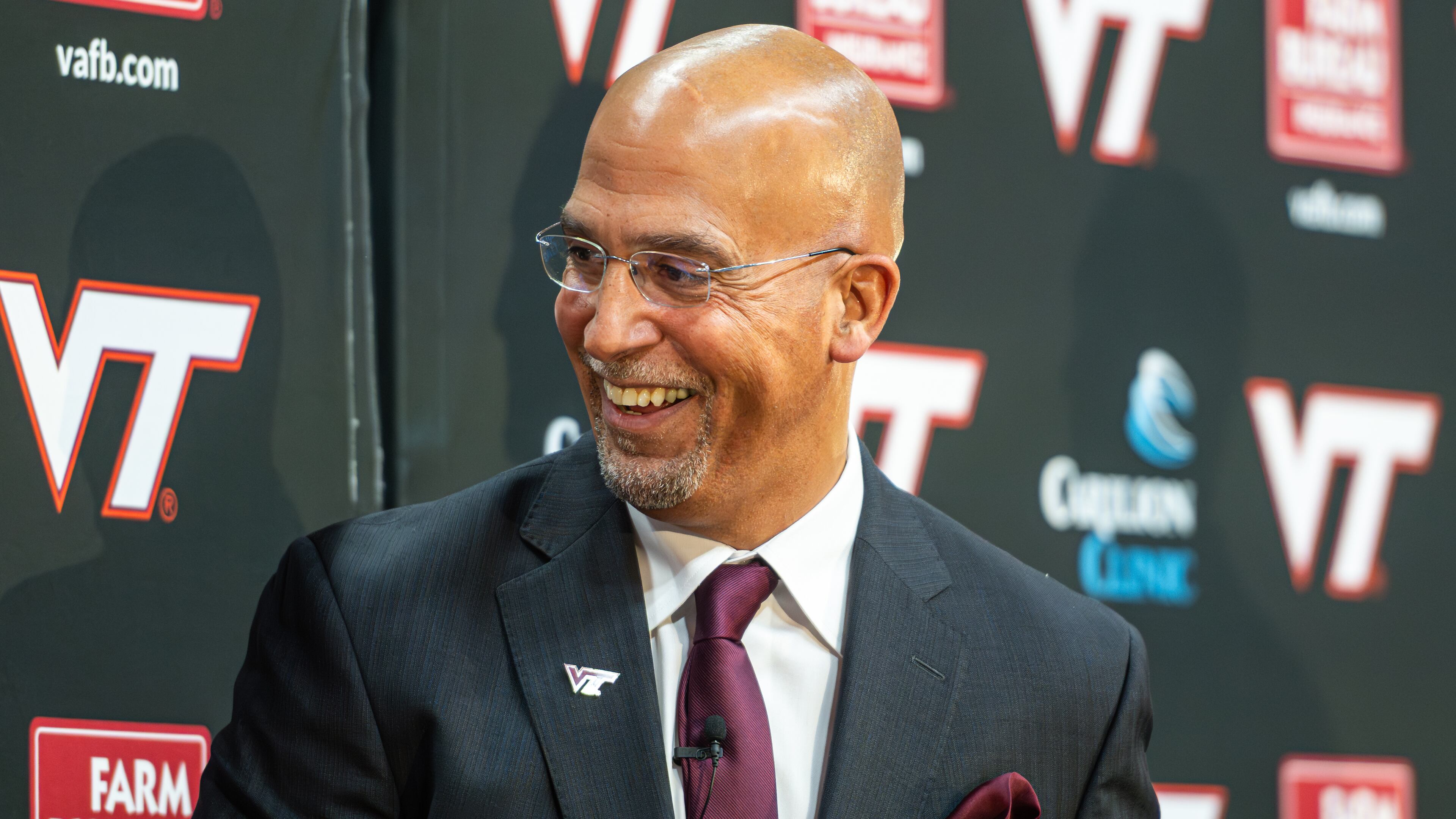 James Franklin, Virginia Tech's new head football coach, smiles after he was presented with a team jersey during an NCAA college football news conference, Wednesday, Nov. 19, 2025, in Blacksburg, Va. (AP Photo/Robert Simmons)