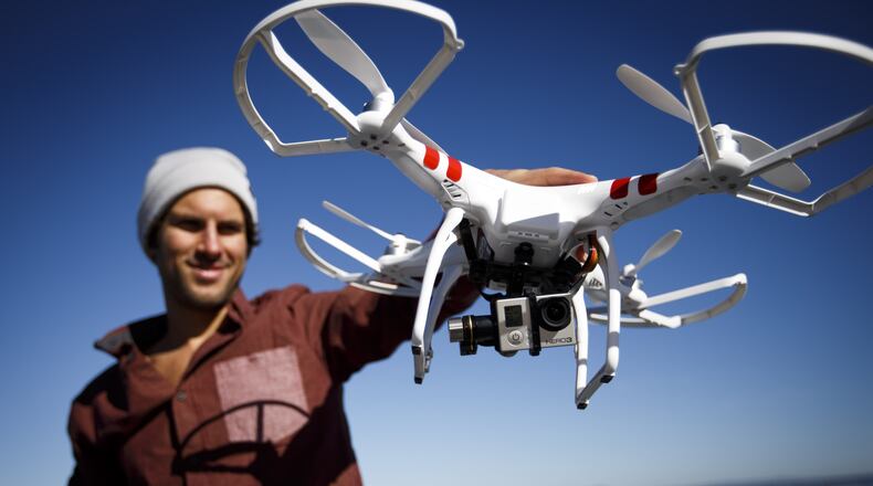 Abe Kislevitz, senior production artist for GoPro, demonstrates a drone named Phantom and made by DJI. Disclaimer: Kislevitz had consumed no alcohol whatsoever, as far as we know. DAI SUGANO/BAY AREA NEWS GROUP/MCT