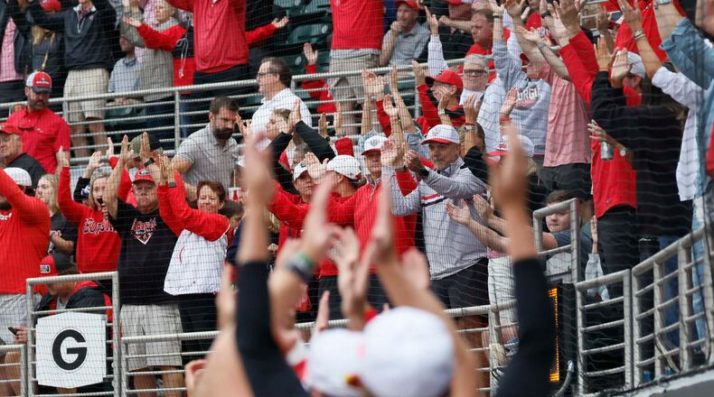Georgia Bulldogs fans and players cheer as Liberty Flames exchange pitchers during the sixth inning of their NCAA Regional final game at Foley Field on Sunday, May 31, 2026, in Athens.(Miguel Martinez/AJC)