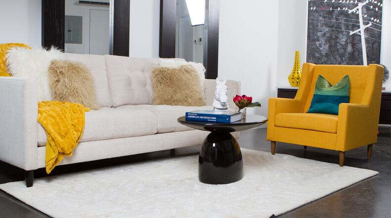 Pops of yellow provide golden accents in this living space. (Handout/TNS)