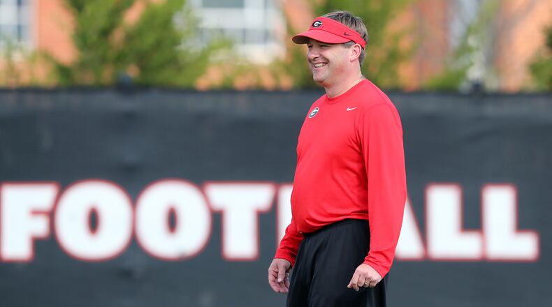 March 21, 2017, Athens: Georgia head football coach Kirby Smart manages a smile while taking the field to watch over the first day of spring football practice at the University of Georgia on Tuesday, March 21, 2017, in Athens.   Curtis Compton/ccompton@ajc.com