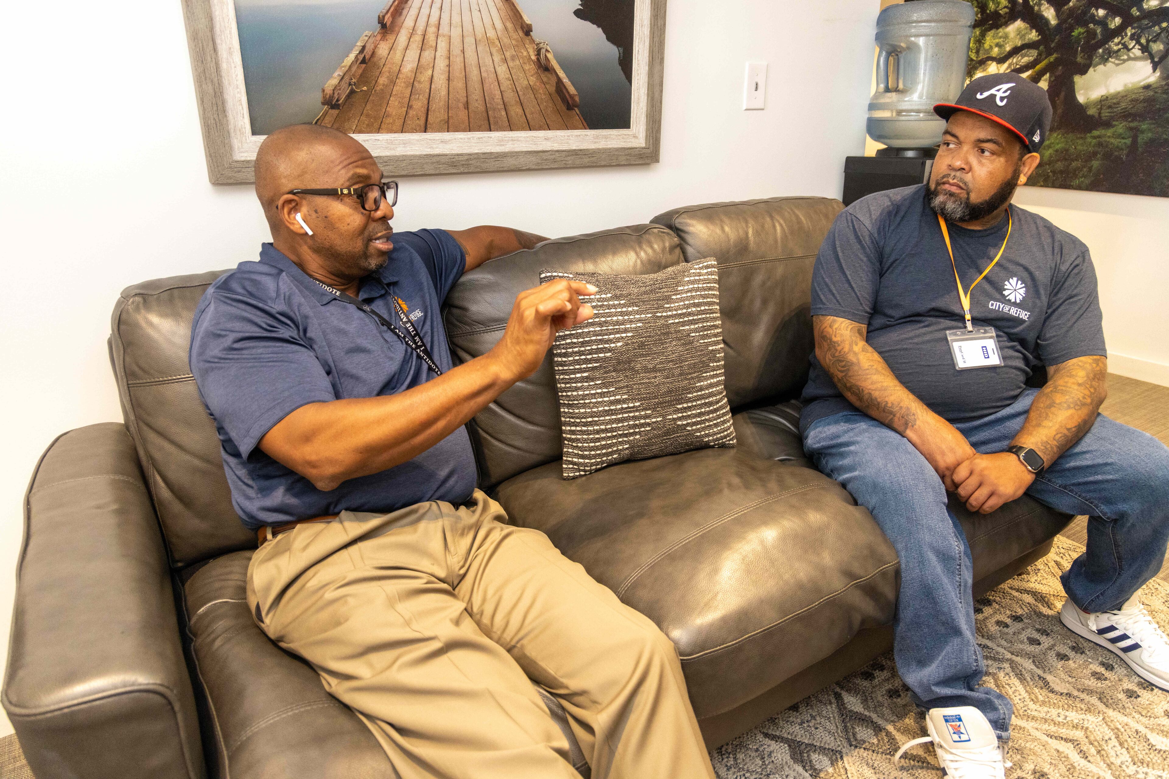 Greg Washington (left) and QuinKnoca Owens (right) work together in the City of Refuge's 345, a transitional housing program for men. (Phil Skinner for the AJC)
