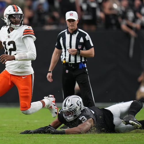 Las Vegas Raiders defensive end Tyree Wilson (9) pressures Cleveland Browns quarterback Shedeur Sanders (12) during the first half of an NFL football game Sunday, Nov. 23, 2025, in Las Vegas. (AP Photo/Eric Gay)