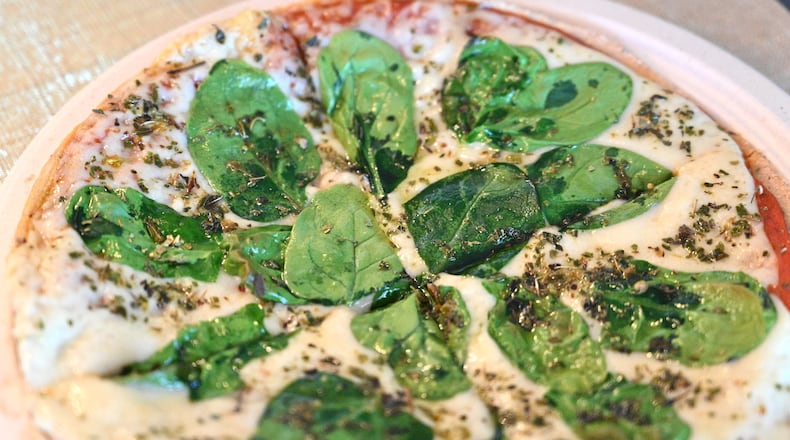 April 2, 2021 Roswell - Vegan Pizza at Cristy's Kitchen in Roswell on Friday, March 2, 2021. Sebastian Gracey and Cristy Kisner were featured on Humans of New York, where creator Brandon Stanton helped raise more than $1.2 million for the restaurant. The couple moved to Roswell from Peru in 2019. after a heart attack in Peru, Gracey let go of his longtime business, which was in bankruptcy, to start over with his family in the U.S. (Hyosub Shin / Hyosub.Shin@ajc.com)