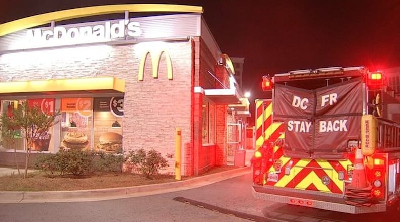 A DeKalb County McDonald’s was forced to close after someone tossed a smoke grenade through a drive-thru window, police said.