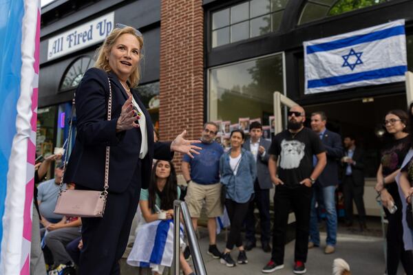 Esther Panitch, D-Sandy Springs, speaks at a Passover gathering at Ali’s Cookies in Atlanta as a concurrent protest for Palestine is held at Emory’s campus on Thursday, April 25, 2024. (Arvin Temkar / AJC)