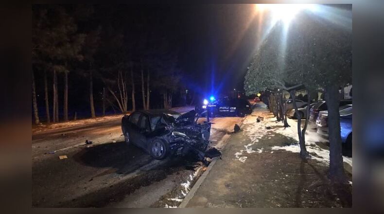 A crash on black ice sent a Fulton County police officer  and another driver to the hospital Friday.