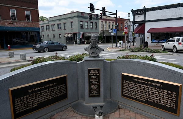 A memorial erected in Washington's town square in 2012 recognizes the contributions of African Americans in the Revolutionary War, part of a broader effort to widen how the period is remembered. (Hyosub Shin/AJC)