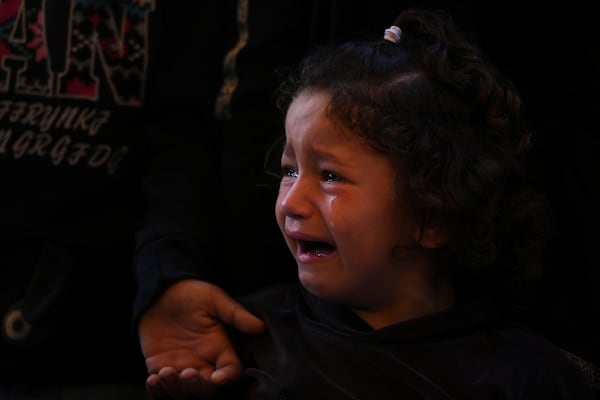 Mira, 4, cries during the funeral of her father, Hosam Wafi who, according to family members, was killed while heading to an aid distribution hub, in Khan Younis, southern Gaza Strip, Monday, June 2, 2025. (AP Photo/Abdel Kareem Hana)