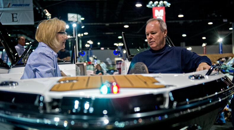 January 17, 2015 Atlanta - Debbie Salsman (left) and her husband Larry sit in the bow of a Monterey 244fs during the Atlanta Boat Show at the Georgia World Congress Center on Saturday, January 17, 2015. The four day show sees tens of thousands of attendees wanting to check out the latest boats and accessories. JONATHAN PHILLIPS / SPECIAL