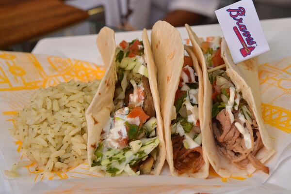 Street tacos from the Taco Factory are one way to go when hunger hits you at SunTrust Park. The meat is prepared in house, as are the trio of salsas. The Taco Factory can be found in several sections at the stadium. CHRIS HUNT / SPECIAL