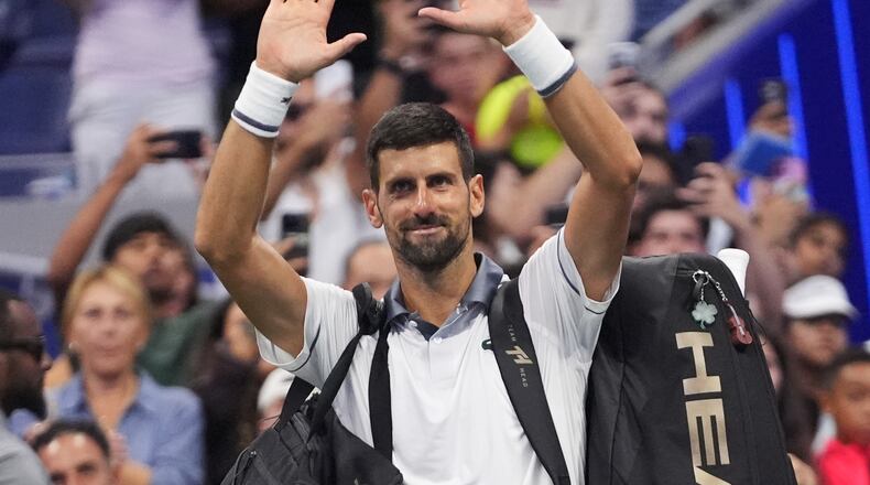 Novak Djokovic, of Serbia, gestures to the crowd after he lost to Mariano Navone, of Argentina, during the first round of the U.S. Open tennis championships Sunday, Aug. 30, 2026, in New York. (AP Photo/Frank Franklin II)