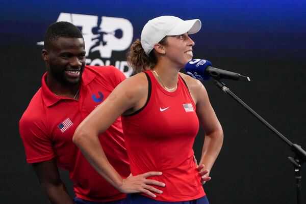 FILE - United States' Frances Tiafoe, left, jokes with teammate Madison Keys during an interview on court following Keys' win over Marie Bouzkova of the Czech Republic in their Group C match at the United Cup tennis event in Sydney, Australia, Thursday, Dec. 29, 2022. (AP Photo/Mark Baker, File)