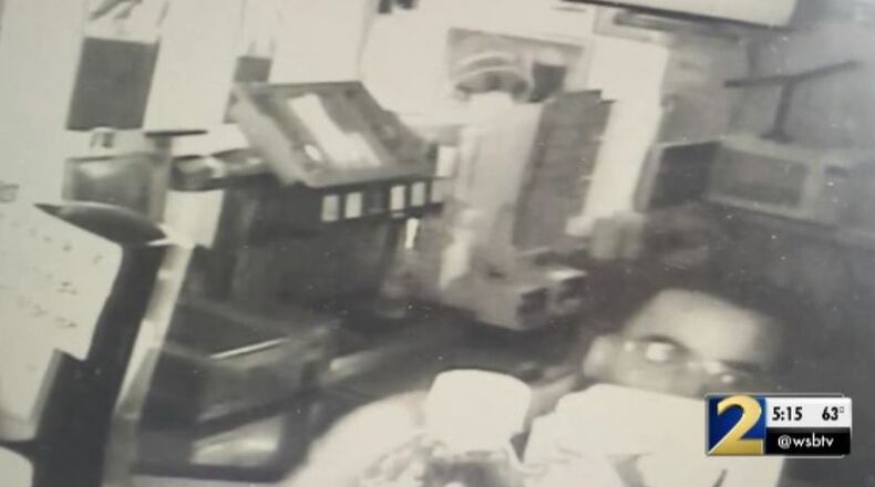 Surveillance footage captures a man suspected of a robbery at North Point Mall in Alpharetta.