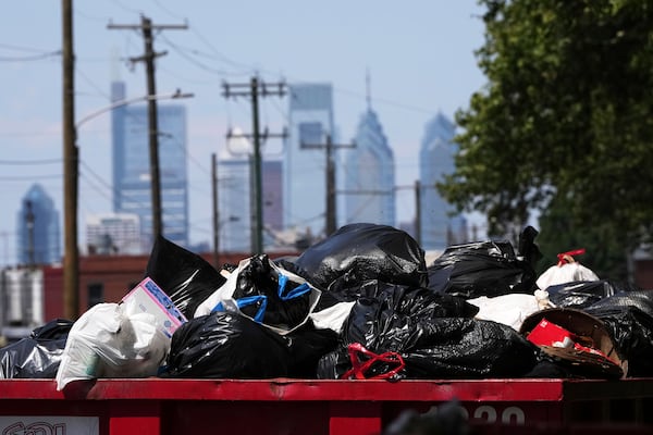 Trash piles up at a garbage collection site, Thursday, July 3, 2025, in Philadelphia. (AP Photo/Matt Slocum)